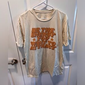 Beige Graphic Tee with Bold Orange Text